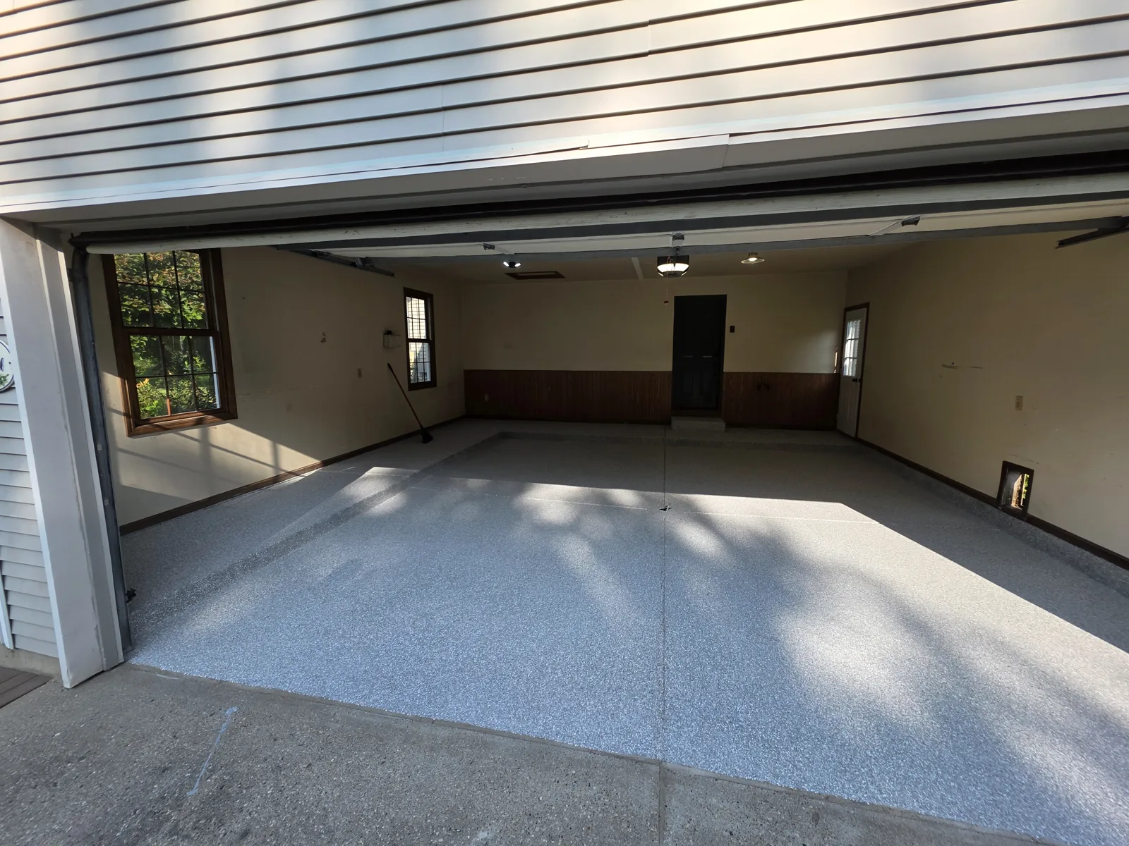 After: durable full-flake garage floor coating finished by Armorforge Coatings, West Michigan